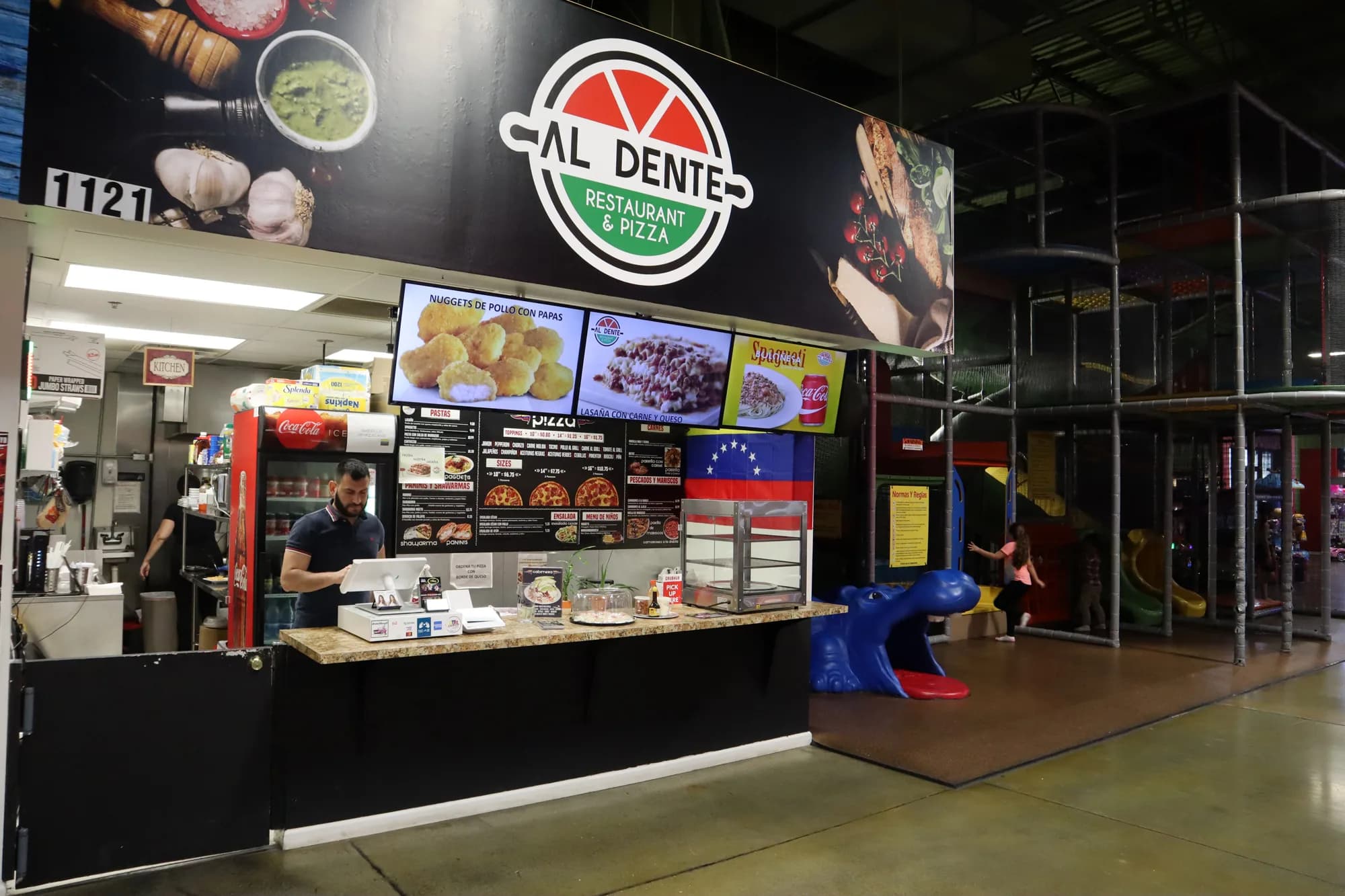 The Duluth counter inside the family entertainment center, with menu screens above it